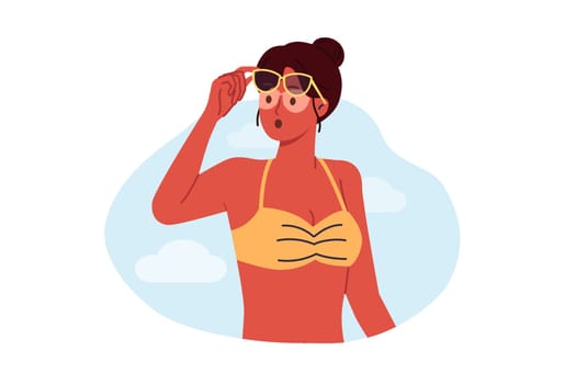 Woman sunbathing received sunburn on body and uneven tan due to sunglasses on eyes. Tourist girl opens mouth in surprise, sees lack of tan under glasses while vacationing at southern resort
