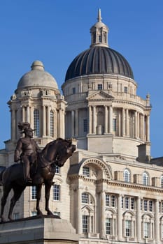 The Port of Liverpool Building and the statue of King Edward VII on the waterfront of the River Mersey in the city of Liverpool in northwest England. This area of the city was given World Heritage Site status by UNESCO in 2004.