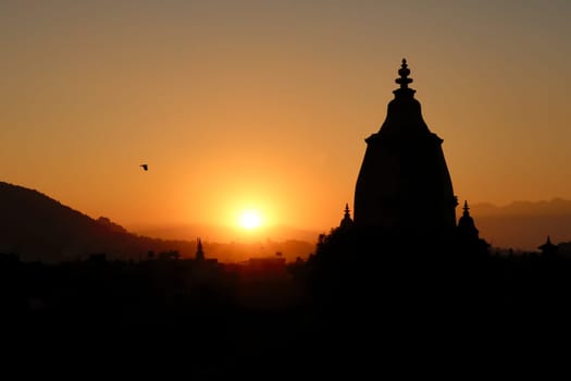 The silhouette, contour of the Shilu, Silu Mahadeva, Mahadev Temple and the skyline of the old town of Bhaktapur at sunset, Bhaktapur, Nepal 2022