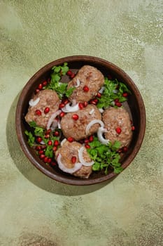 Overhead view of traditional Georgian fried meal Apkhazura in clay pot