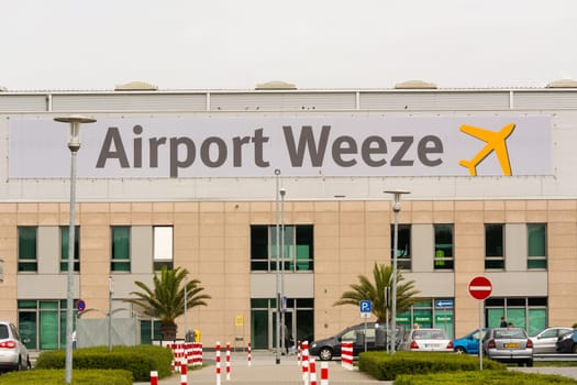WEEZE, NRW, GERMANY - SEPTEMBER 10, 2018: Entrance area of regional airport Weeze photographed from the parking lot
