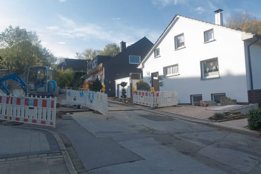 HEILIGENHAUS, NRW - OCTOBER 29, 2019: Civil engineering works for the installation of gas, water and power lines for a new environmentally friendly fuel cell heating