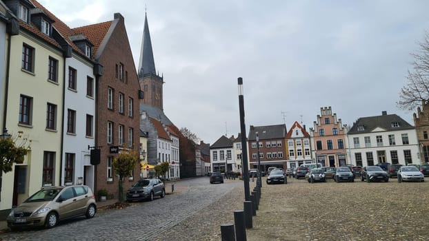 KALKAR NRW, GERMANY - NOVEMBER 14, 2021: Trees and houses in the city against the sky in autumn