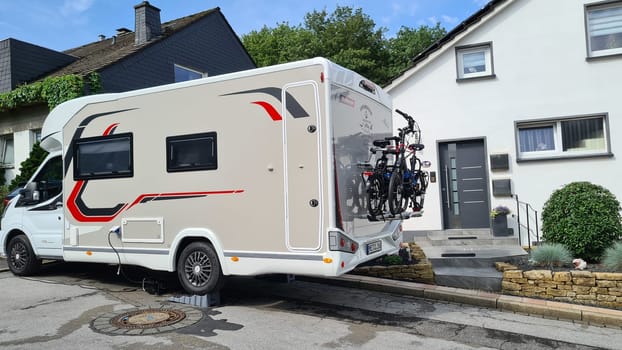 HEILIGENHAUS, NRW, GERMANY - AUGUST 09, 2021: Motorhomes and campers for sale or rent. Concept freedom, family holiday travel, vacation travel with camper.