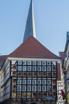 HATTINGEN OLD TOWN, NRW, GERMANY - DEZEMBER 05, 2016:  Huge Advent calendar on a half-timbered house in Hattingen. People at the Christmas market in Hattingen.
