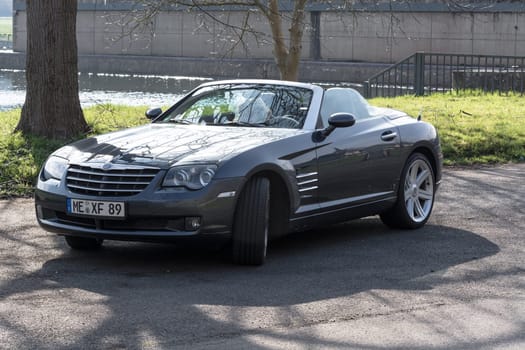 MOSEL, GERMANY - MARCH 26, 2016: Chrysler Crossfire Roadster in a parking lot in Germany on the Mosel.
