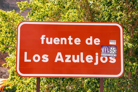 Gran Canaria, Spain, Canary Islands, Los Azulejos - Jul 20. Sign at the viewpoint called "Fuente de Los Azulejos"" (Fountain of Ceramic Tiles) because of the colorful layers of stone."
