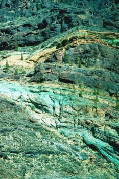 Gran Canaria, Spain, Canary Islands, Los Azulejos. The spectacular colorful volcano veins of rock were formed millions of years ago during the formation of the island.