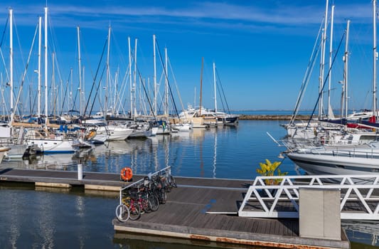 Lisbon, Portugal: April 12, 2024: Plenty of boats docking at marina near the Belem Monument of Discoveries in Lisbon, Portugal.