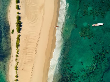 Aerial view of of a tropical beach and lagoon in Polynesia.