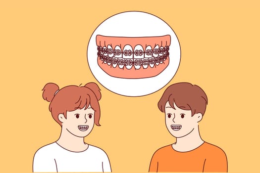 Dental braces in mouth of boy and girl visiting dentist for teeth straightening procedure. Happy children demonstrate braces, wanting to achieve beautiful smile and get rid of dental problems