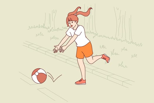Little girl plays ball on road, putting own life at risk because of lack of parental supervision. Danger for child at risk of becoming victim of accident due to lack of knowledge of traffic rules