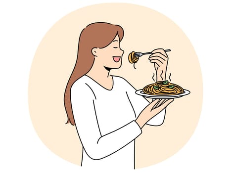 Woman stands with plate of spaghetti in hands and eats italian dish enjoying taste of pasta. Girl eats pasta to satisfy hunger and rejoice at opportunity to try delicious high-calorie food