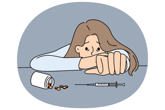 Woman addicted to drugs reaches for syringe or pills to forget about financial and personal problems. Young addicted girl needs doctor help to stop using antidepressants and narcotic substances