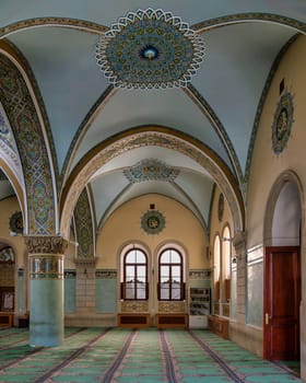 Interior of of Icherisheher Juma Mosque in Baku, Azerbaijan, with Intricate details featuring stunning arches and colorful artistic motifs