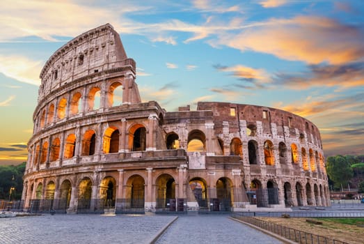Roman Coliseum under the clouds at sunset, summer view, Italy, no people.
