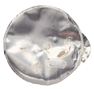 Round aluminum thin lid for plastic yogurt jars, sour cream on a white background, top view