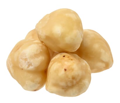 Stack of peeled hazelnuts on isolated background, close up