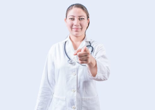 Smiling female doctor pointing at the camera. Happy female doctor pointing at you, Young doctor pointing at you
