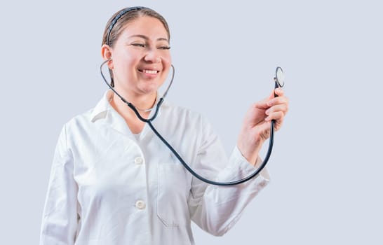 Smiling female doctor hand holding stethoscope isolated. Young female doctor holding stethoscope on white background