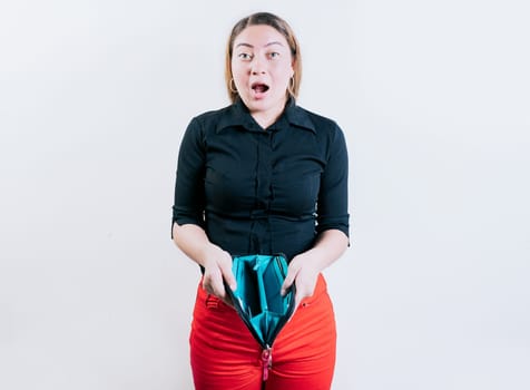 Shocked young woman showing empty wallet isolated. Unemployed girl without money showing empty wallet