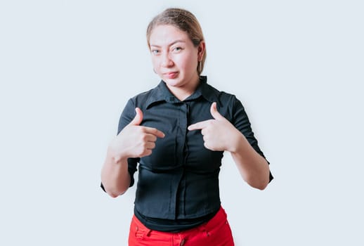 Embarrassed girl pointing at herself isolated. Confused latin girl pointing at herself isolated