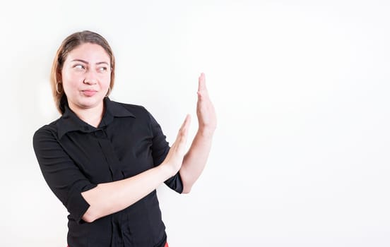 Displeased young woman rejecting with palms hands isolated. Disgusted young woman with rejection gesture. He frowns in disgust