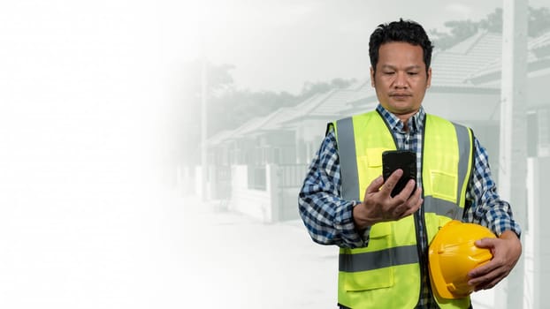 Engineer architect with protective helmet working at house building on construction site background, Housing projects, Residential construction projects.
