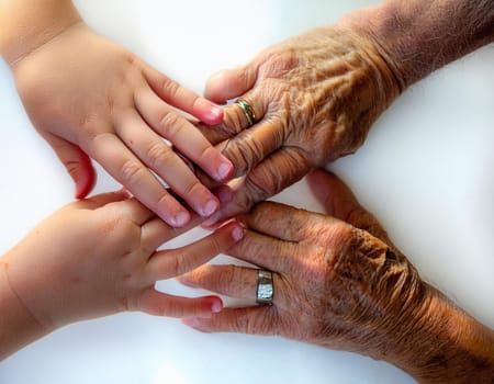 A tower of hands from people of different ages