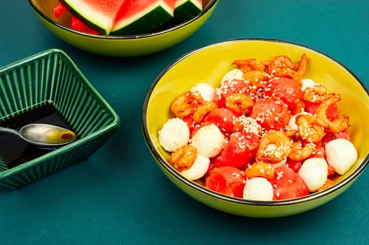 Delicious fresh salad with watermelon, mozzarella cheese and shrimp.