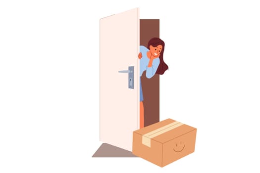 Woman rejoices at receiving package delivery by courier and looks out of apartment through open door. Targeted delivery from online store evokes positive emotions in girl who loves internet shopping