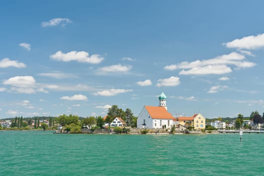 View of the municipality of Wasserburg on Lake Constance, Bodensee with the church of St. George seen from the lake