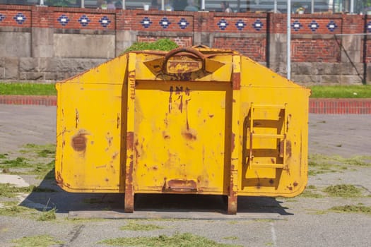 Orange skip with plant waste , Germany