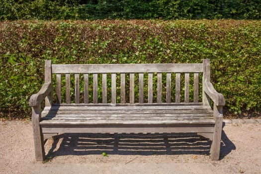 Old wooden bench in a park, Germany