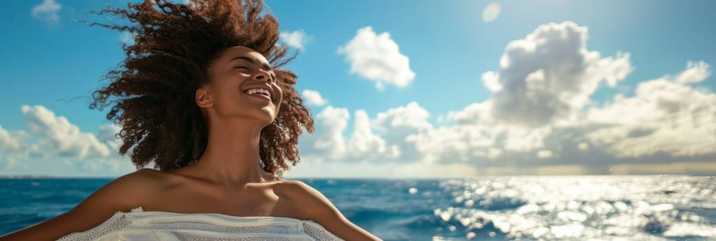 Woman in a light light dress on a yacht against the background of blue sky, smiling brightly and looking at the sky, feeling the wind
