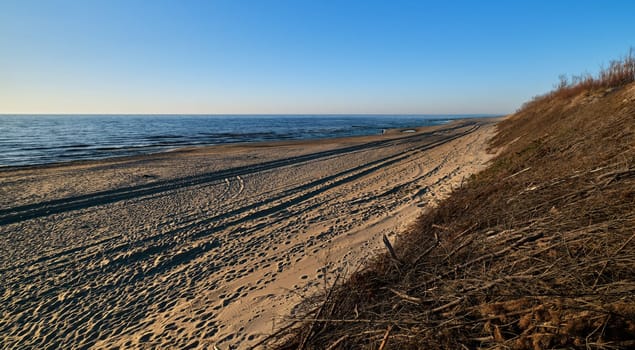 Beautiful, ethereal, calm sunset at Baltic sea and nordic dunes of Curonian spit, Nida, Lithuania