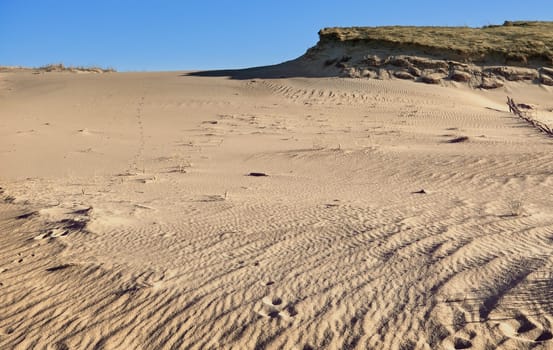 Nordic dunes, Baltic sea, Curonian spit, Nida, Klaipeda, Lithuania at sunset. Lines, rhythm and patterns of shadows and hills