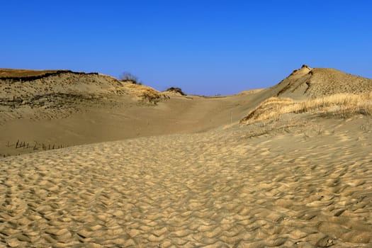 Nordic sand dunes, Baltic sea, Curonian spit, Nida, Klaipeda, Lithuania at sunset. Lines, rhythm and patterns of shadows