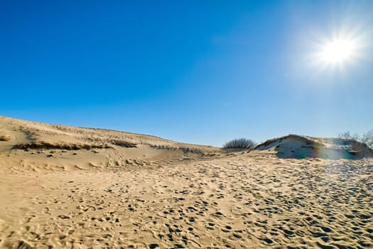 Nordic sand dunes, Baltic sea, Curonian spit, Nida, Klaipeda, Lithuania at sunset. Lines, rhythm and patterns of shadows and hills