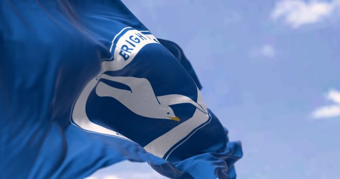 Brighton, UK, May 2023: Brighton and Hove Albion Football Club flag waving in the wind on a clear day. English Premier League team. Illustrative editorial 3d illustration render. Selective focus