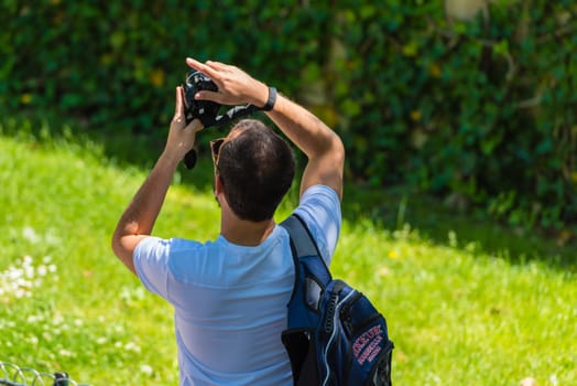 FRANCE, PARIS - JUNE 06: Man taking pictures on the street on June 06, 2015