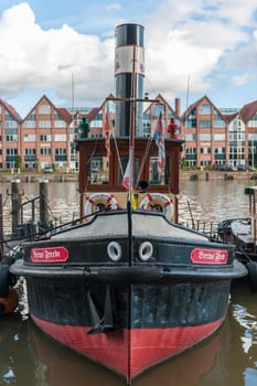 Frontal view of the traditional tug "Bertus Freede"" in the Leer museum harbor under a slightly cloudy sky. Decommissioned in 1993. Used as a club excursion steamer since 1998."