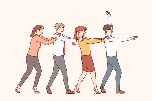 Team building for business people performing dance together holding shoulders and pretending to be train. Team building strengthens friendship between office employees and increases trust