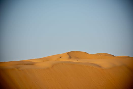 Desert dunes in Liwa, Abu Dhabi, United Arab Emirates during sunset