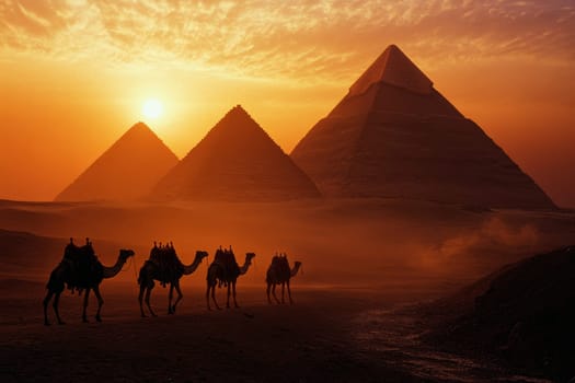 Silhouettes of camels and riders in front of the Great Pyramids of Giza during a golden sunset.