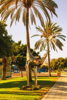Gran Canaria, Spain, Canary Islands, Las Palmas - Jul 22, 2024. A metallic animal skulpture on a street in the near of holiday world  Gran Canaria Maspalomas.
