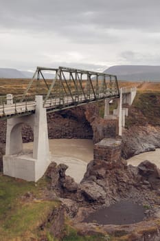 Bridge on The Skjalfandafljot river in Iceland. Overcast Gloomy Weather