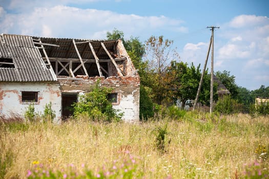 Abandoned farm house in a field. Horizontal shot