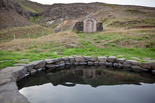 Hot spring outdoor bath in Iceland. Nordic calm nature