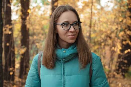 Autumn portrait of beautiful woman on fall nature background